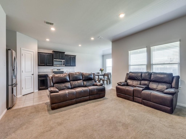 16757 Portage St, Justin, TX 76247 - living area featuring light carpet, recessed lighting, bar area, and baseboards