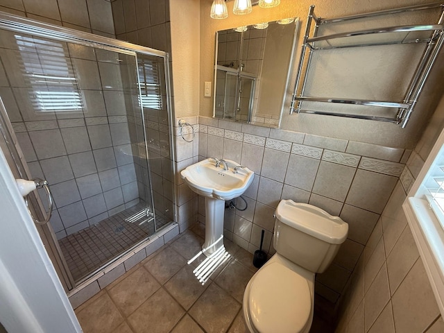 2325 S 40th St, Abilene, TX 79605 - full bath featuring tile walls, a stall shower, toilet, and tile patterned floors