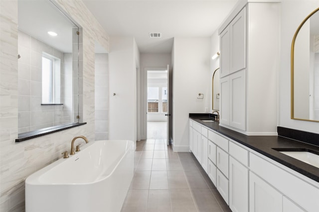 4160 Rosita Ln, Prosper, TX 75078 - bathroom with a soaking tub, tile patterned floors, and double vanity