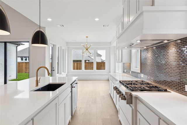 4160 Rosita Ln, Prosper, TX 75078 - kitchen with a sink, appliances with stainless steel finishes, white cabinetry, light countertops, and recessed lighting