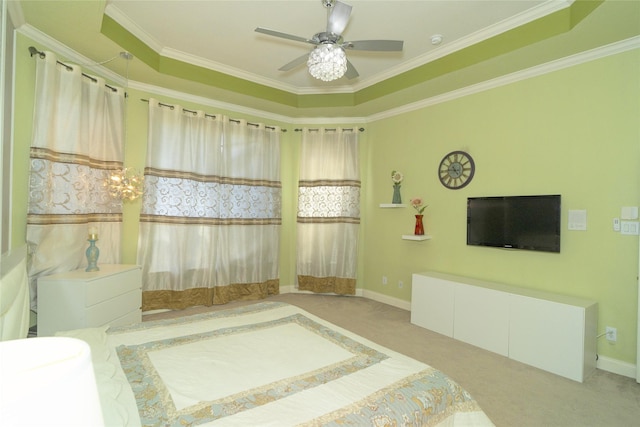carpeted bedroom with crown molding and a ceiling fan