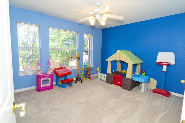 playroom with carpet flooring and baseboards
