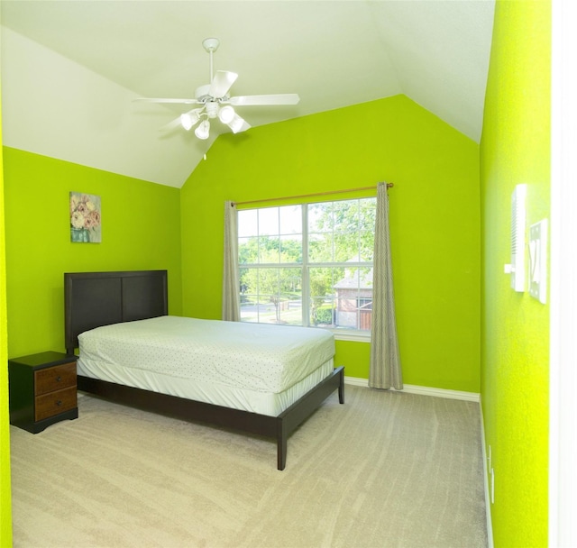 bedroom with lofted ceiling, carpet, baseboards, and ceiling fan