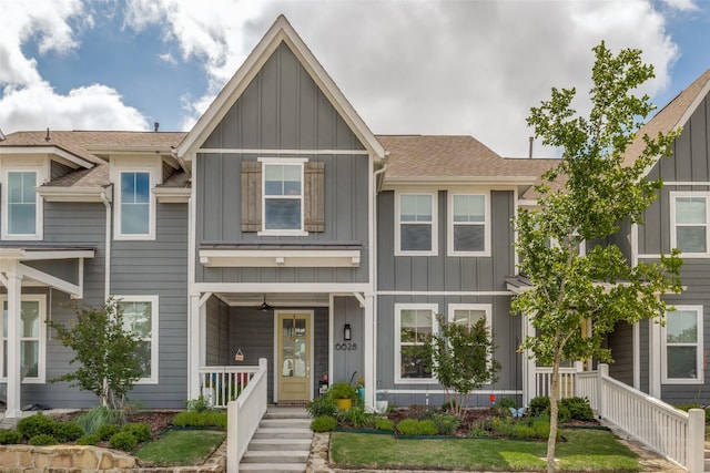 6628 Kort St, Rowlett, TX 75089 - townhome / multi-family property with board and batten siding, a porch, and a shingled roof