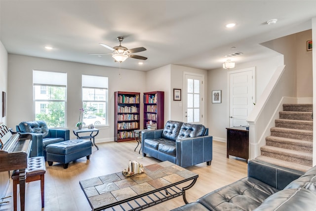 6628 Kort St, Rowlett, TX 75089 - living area with light wood-style floors, ceiling fan, stairs, baseboards, and recessed lighting