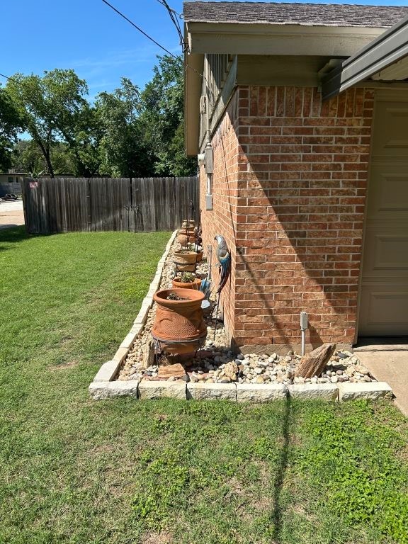 5004 Blackstone Dr, River Oaks, TX 76114 - exterior view of brick siding and fence