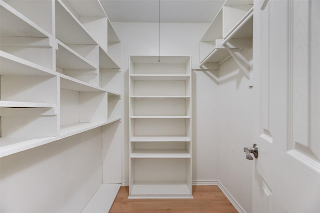 2508 Oak Manor Ct, Arlington, TX 76012 - spacious closet featuring wood finished floors