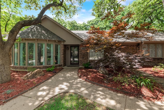 2508 Oak Manor Ct, Arlington, TX 76012 - view of front of property with roof with shingles and a sunroom