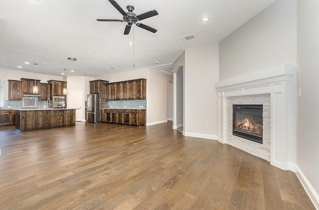 413 Allbright Rd, Celina, TX 75009 - unfurnished living room with ceiling fan, dark wood-style floors, a fireplace, recessed lighting, and baseboards