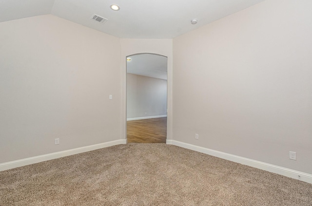 413 Allbright Rd, Celina, TX 75009 - empty room with arched walkways, carpet, lofted ceiling, baseboards, and recessed lighting