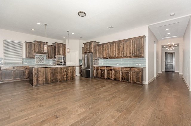 413 Allbright Rd, Celina, TX 75009 - kitchen featuring stainless steel appliances, decorative backsplash, dark brown cabinets, dark wood finished floors, and recessed lighting