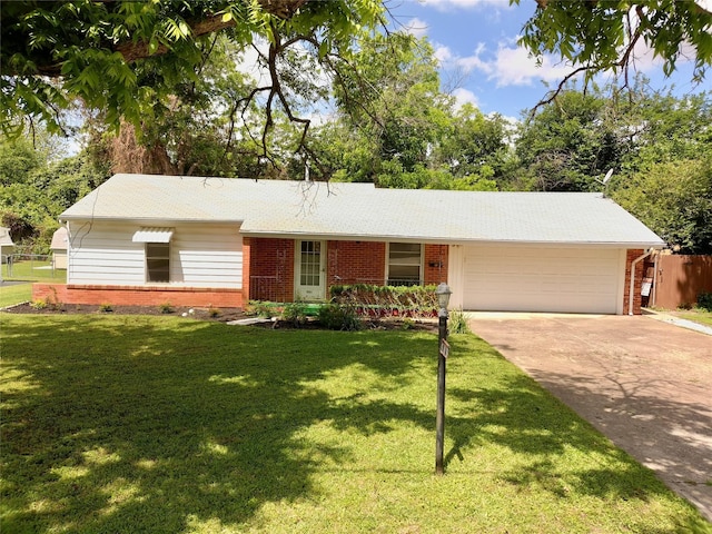 909 Hallum St, River Oaks, TX 76114 - ranch-style home with brick siding, a garage, and driveway