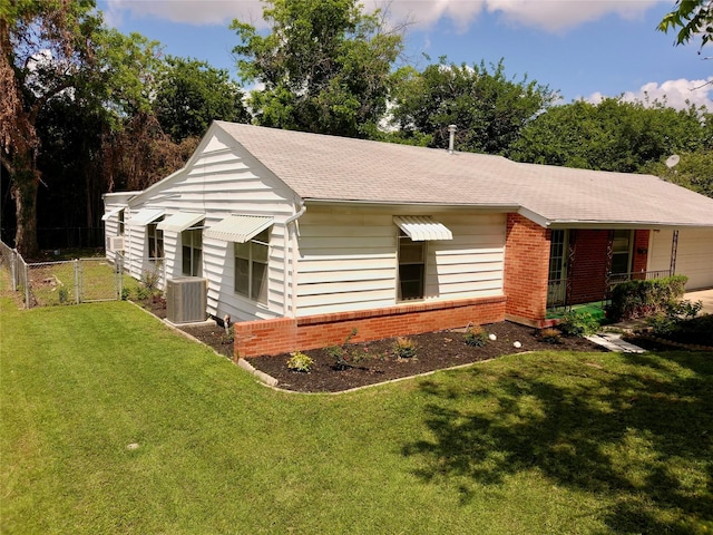 909 Hallum St, River Oaks, TX 76114 - view of property exterior with brick siding, covered porch, central AC unit, a shingled roof, and a gate