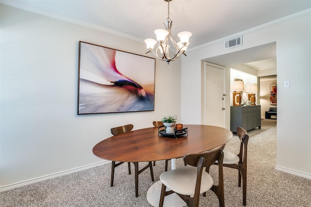 dining room featuring light colored carpet, a chandelier, ornamental molding, and baseboards