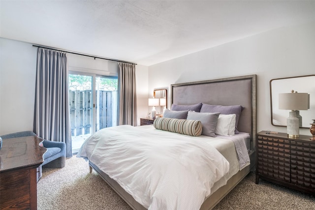 carpeted bedroom with access to exterior