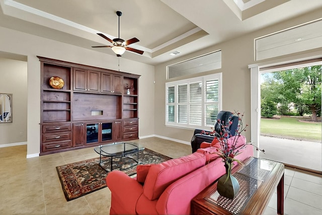 11908 Glenbrook St, Denton, TX 76207 - living area featuring light tile patterned floors, a ceiling fan, baseboards, and crown molding