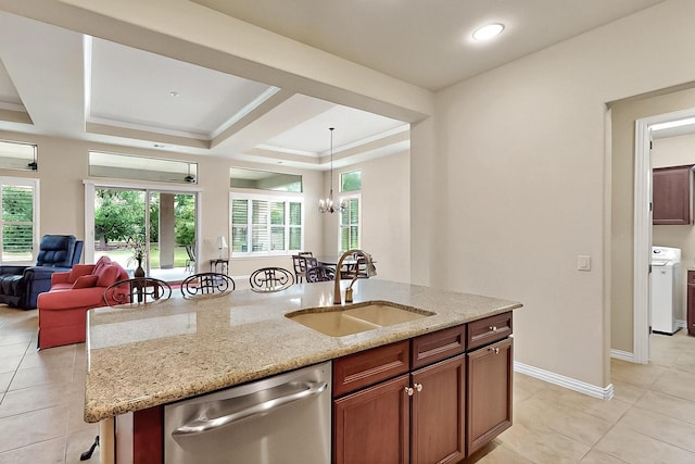 11908 Glenbrook St, Denton, TX 76207 - kitchen with dishwasher, a sink, stove, open floor plan, and decorative light fixtures