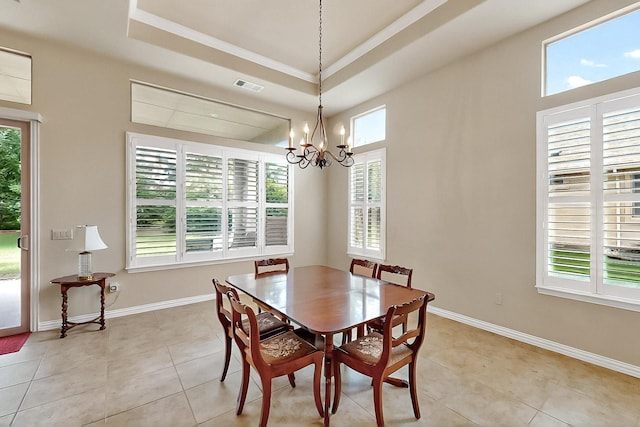 11908 Glenbrook St, Denton, TX 76207 - dining area with a chandelier, crown molding, light tile patterned floors, a raised ceiling, and baseboards
