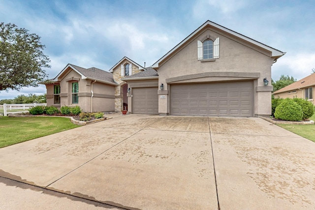 11908 Glenbrook St, Denton, TX 76207 - traditional-style home featuring stucco siding, driveway, and an attached garage
