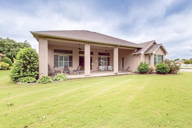 11908 Glenbrook St, Denton, TX 76207 - back of property featuring ceiling fan, stucco siding, a lawn, and a patio area