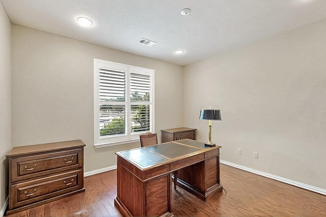 11908 Glenbrook St, Denton, TX 76207 - home office featuring baseboards, wood finished floors, and recessed lighting