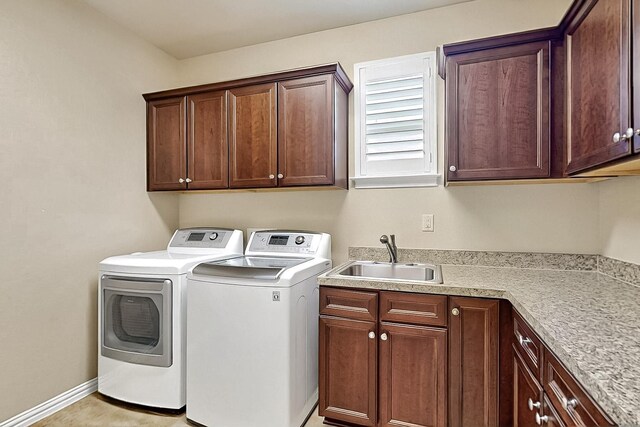 11908 Glenbrook St, Denton, TX 76207 - clothes washing area featuring cabinet space, washing machine and clothes dryer, and baseboards