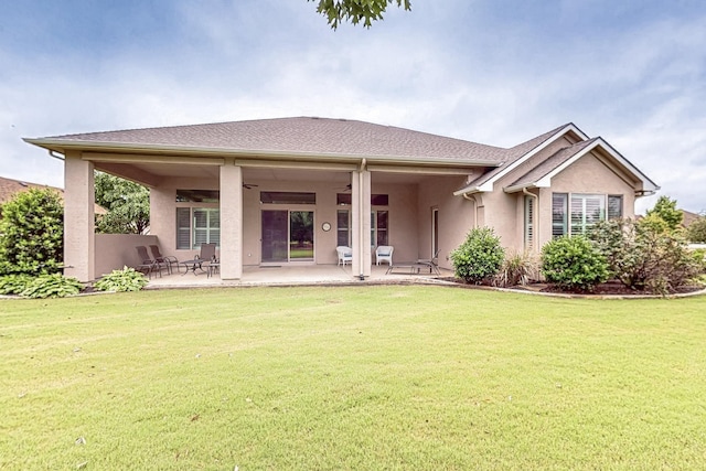 11908 Glenbrook St, Denton, TX 76207 - back of property featuring ceiling fan, stucco siding, a yard, and a patio area
