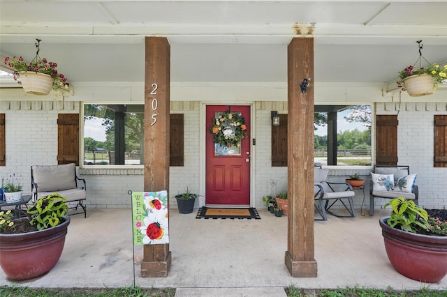 205 Davis Rd, Combine, TX 75159 - property entrance featuring covered porch and brick siding