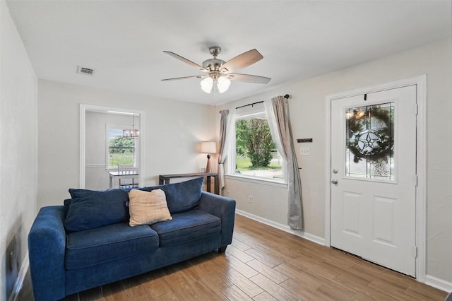 205 Davis Rd, Combine, TX 75159 - living area with light wood-style floors, plenty of natural light, ceiling fan, and baseboards