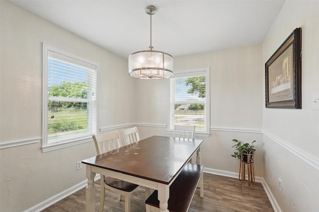 205 Davis Rd, Combine, TX 75159 - dining space with wood finished floors, a chandelier, and baseboards