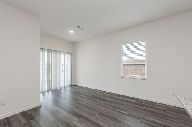 6303 Tropicana Ln, Forney, TX 75126 - empty room with plenty of natural light, dark wood-type flooring, baseboards, and recessed lighting