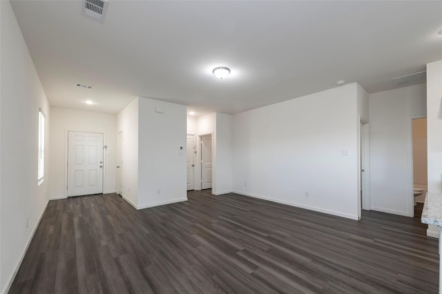 6303 Tropicana Ln, Forney, TX 75126 - spare room with dark wood-type flooring and baseboards