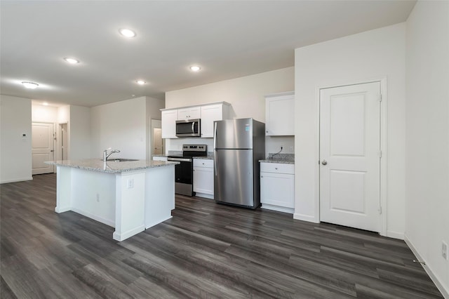 6303 Tropicana Ln, Forney, TX 75126 - kitchen featuring appliances with stainless steel finishes, dark wood finished floors, white cabinets, a sink, and recessed lighting