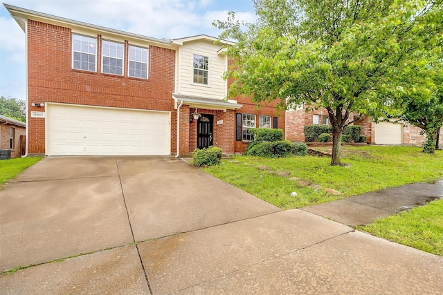 10053 Pronghorn Ln, Fort Worth, TX 76108 - traditional-style house featuring an attached garage, driveway, a front yard, and brick siding