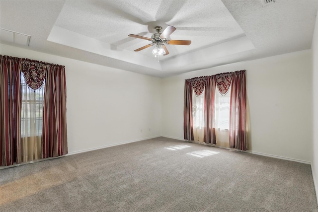 221 Valley Ranch Rd, Weatherford, TX 76087 - carpeted empty room with a tray ceiling, a ceiling fan, and a textured ceiling
