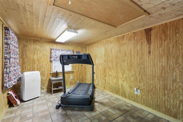 221 Valley Ranch Rd, Weatherford, TX 76087 - exercise room with wooden ceiling, brick patterned floors, and wooden walls