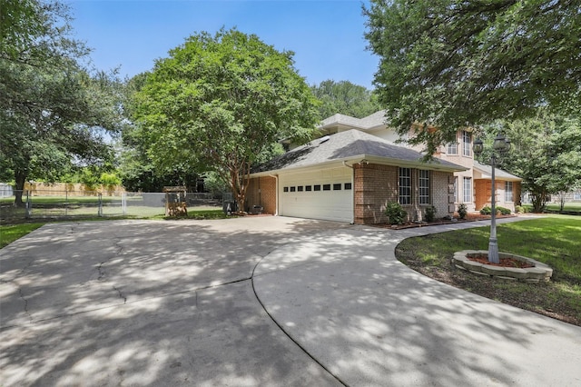 221 Valley Ranch Rd, Weatherford, TX 76087 - view of front facade featuring concrete driveway, a garage, and brick siding