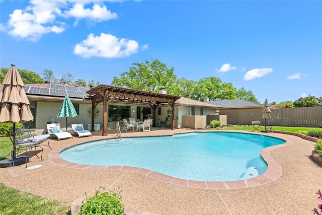 view of swimming pool with a pergola, fence, and a patio area