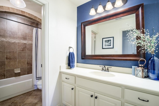 full bath with vanity, toilet, and shower / tub combo