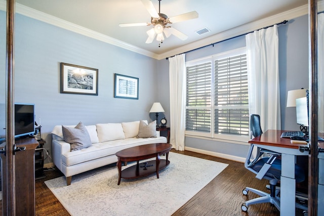 home office with baseboards, crown molding, a ceiling fan, and dark wood-style flooring