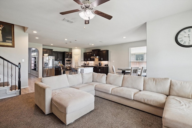 1127 Donnington Trl, Saginaw, TX 76131 - living area with stairway, a ceiling fan, and recessed lighting