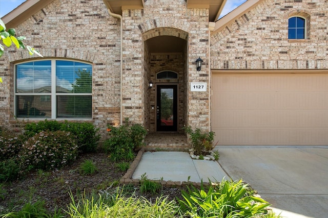 1127 Donnington Trl, Saginaw, TX 76131 - doorway to property featuring driveway and an attached garage