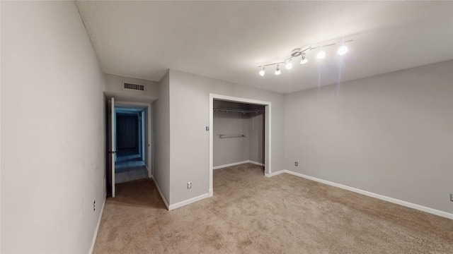 2810 Dove Meadow Dr, Garland, TX 75043 - unfurnished bedroom with light carpet, baseboards, and a closet