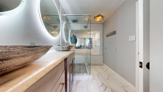 2810 Dove Meadow Dr, Garland, TX 75043 - full bath with vanity, marble finish flooring, a shower stall, and baseboards