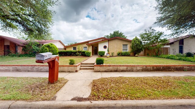2810 Dove Meadow Dr, Garland, TX 75043 - ranch-style house featuring a front yard