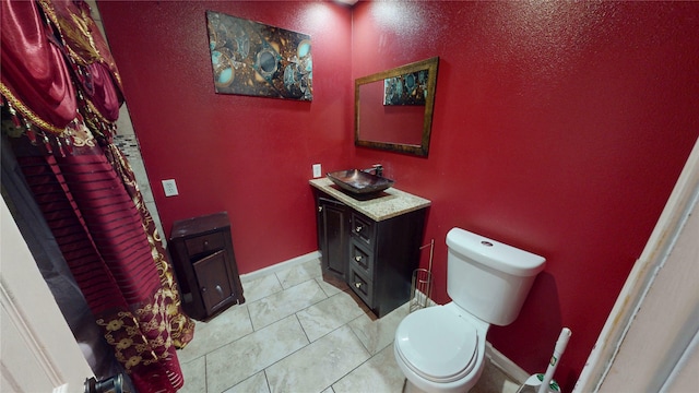2810 Dove Meadow Dr, Garland, TX 75043 - bathroom featuring toilet, vanity, and baseboards