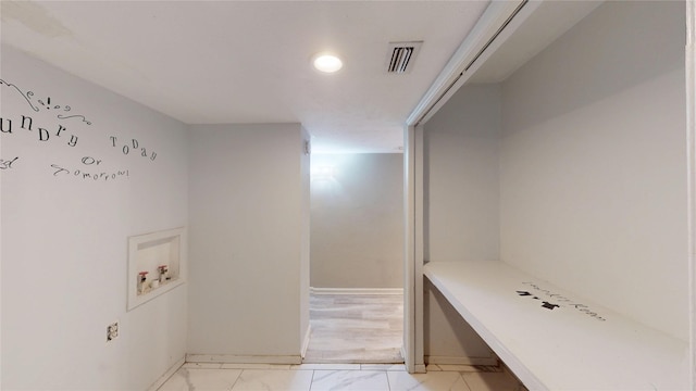 2810 Dove Meadow Dr, Garland, TX 75043 - laundry room featuring light marble finish floors, recessed lighting, washer hookup, and baseboards