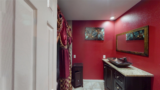 2810 Dove Meadow Dr, Garland, TX 75043 - corridor with light marble finish flooring, a sink, and baseboards