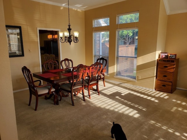 carpeted dining room featuring crown molding, a chandelier, baseboards, and a towering ceiling