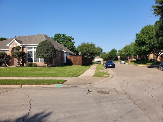 view of road with sidewalks and curbs